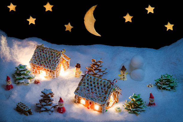 istock Snowy gingerbread village with stars and moon 507397879