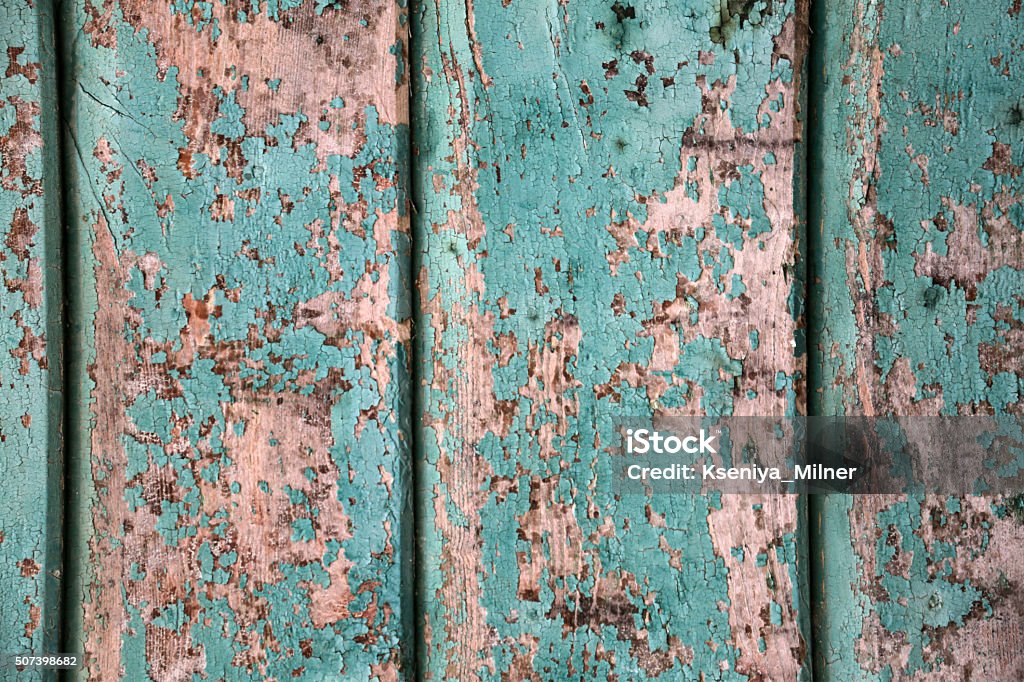 Background - crackled turquoise paint on a wooden wall Close-up of a wall of an Italian house Abandoned Stock Photo