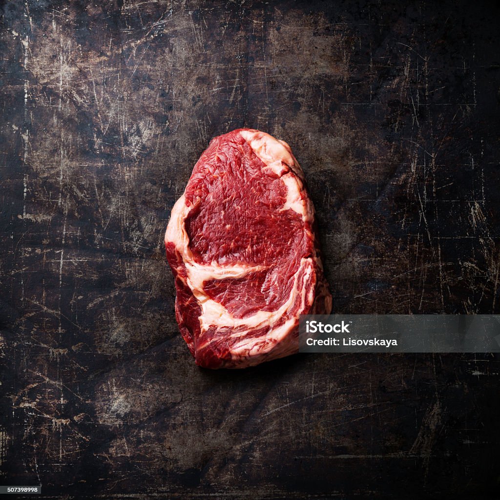 Raw meat Steak on dark background Raw fresh meat Ribeye Steak on dark metal background Steak Stock Photo