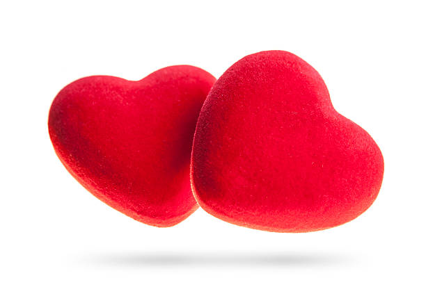Two velvet hearts isolated on a white background.