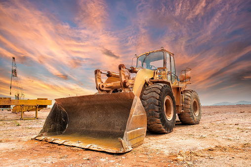 Bulldozer loader machine during earthmoving works outdoors
