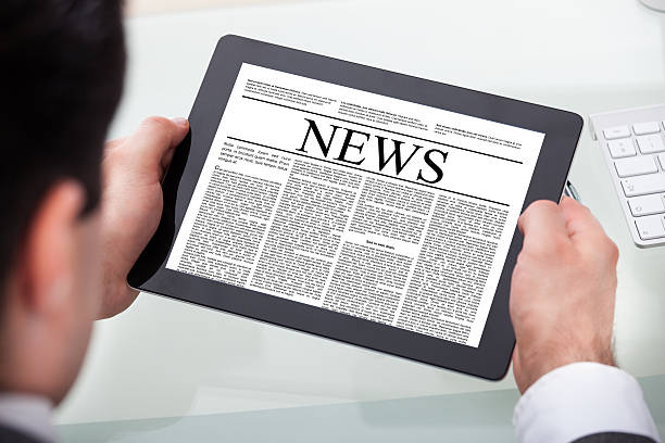 istock Businessman Reading News On Digital Tablet 507399977