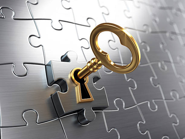 golden key and puzzle - lock stockfoto's en -beelden