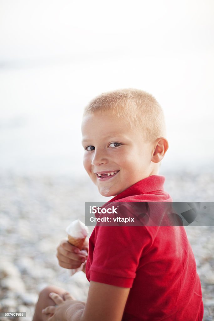 Boy enjoying ice cream cone Boy enjoying ice cream cone on the beach 6-7 Years Stock Photo