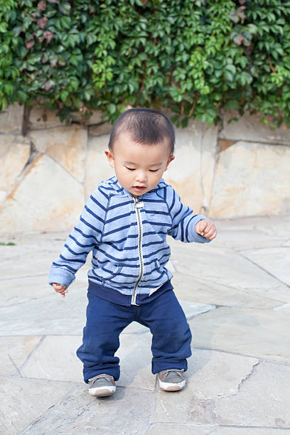 istock Cute Chinese baby boy playing outdoors 507402002