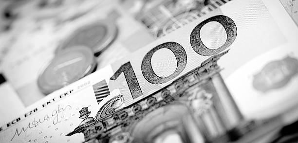 istock Closeup of banknotes and coins 507402080