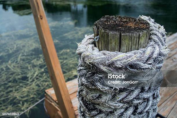 Nautical Rope Around Wood Telephone Pole On Wooden Dock Macro Stock Photo - Download Image Now