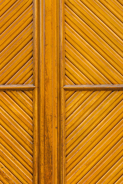 istock wooden rhomboid pattern in a yelowish  door 507402885