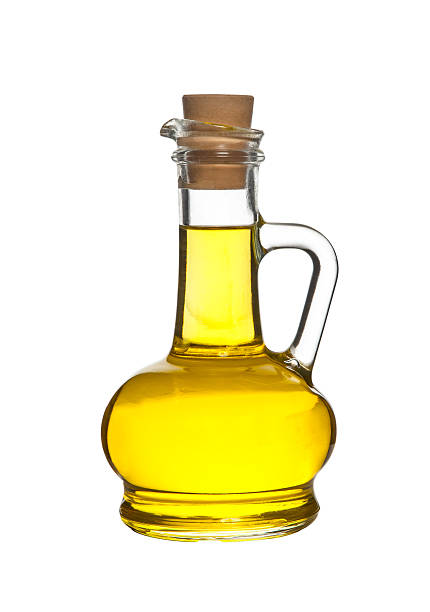 istock Bottle of olive oil the table isolated on white 507403087