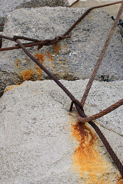 istock Steel cable anchored to the rock 507403880