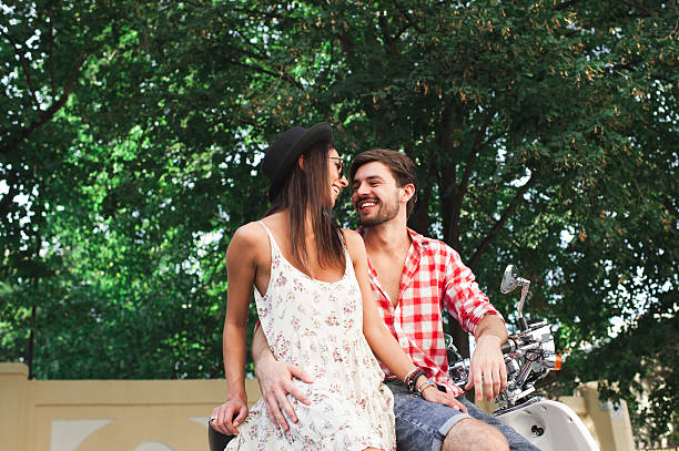 istock Fashion couple embracing on scooter 507403998