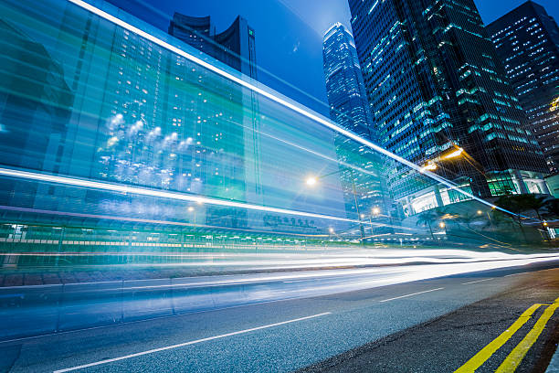 istock Lights Streaking in Arc at Night in Hong Kong 507405408