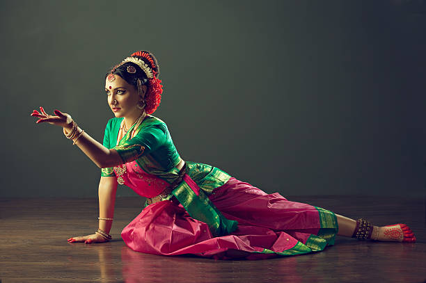 Girl dancing classical indin dance Kuchipudi. Girl, dressed in traditional national costume, dancing classical indian dance Kuchipudi. Emotional gestures of indian dance kuchipudi. indian music stock pictures, royalty-free photos & images