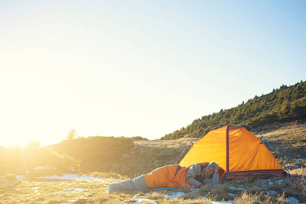 istock Girl lying in a sleeping bag. 507421620