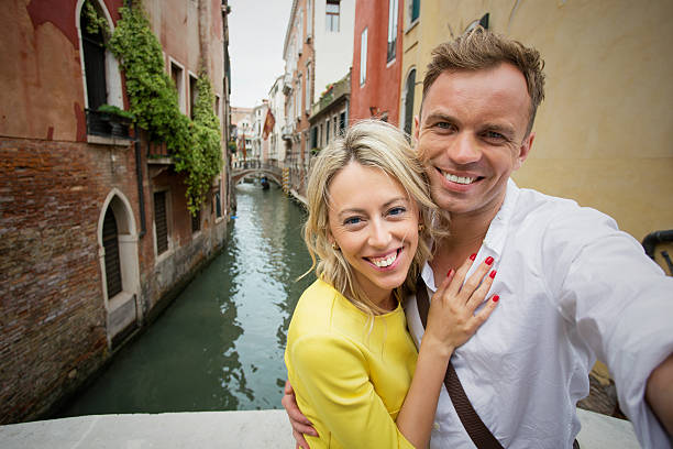 istock Couple taking selfie picture in Venice 507422712