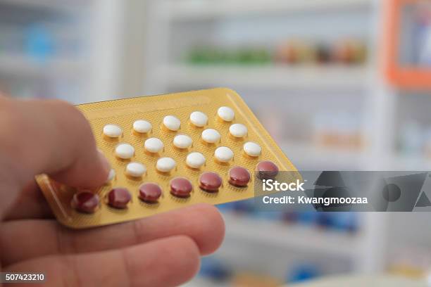 Close Up Of Pharmacist Hands Holding Contraceptive Pills Stock Photo - Download Image Now