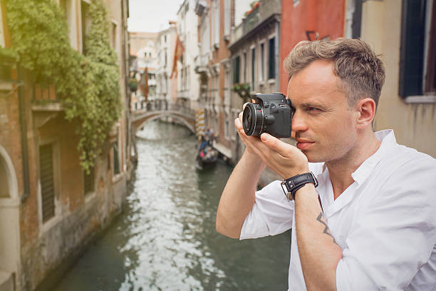 istock Tourist in Venice taking pictures with digital camera 507423406