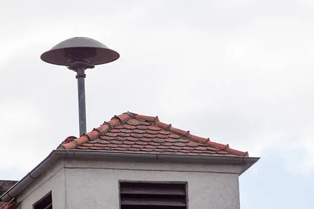 On German roofs - a siren on a building roof