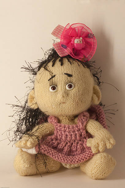 istock knitted toy girl, as a background for your desktop 507426596