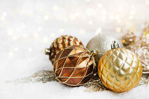 Golden Christmas ornaments with delicate globes and lights