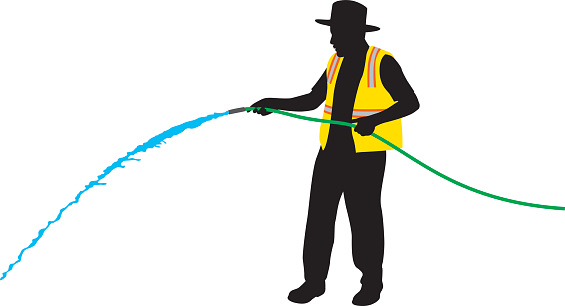 Vector silhouette of a construction worker wearing a safety vest and hold a hose.