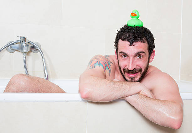 istock man in bathtub with rubber duck 507427478