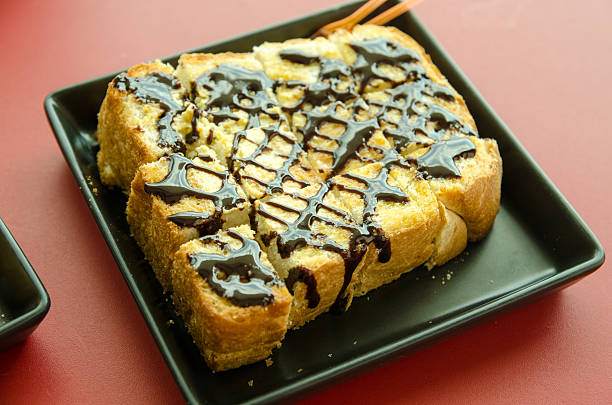 istock toast butter with chocolate topping , selective focus 507427886