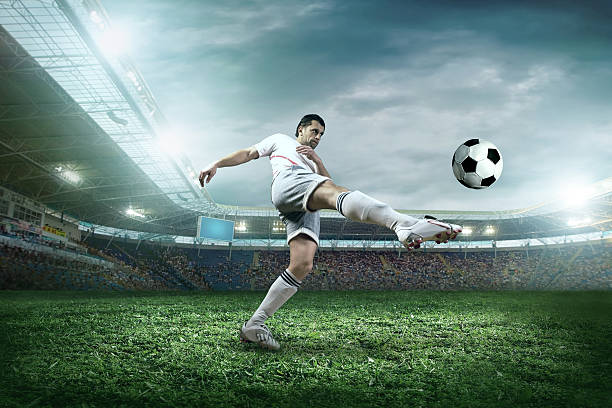 istock Soccer player with ball in action at stadium 507427903