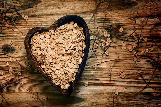 Oat flakes in a wooden bowl