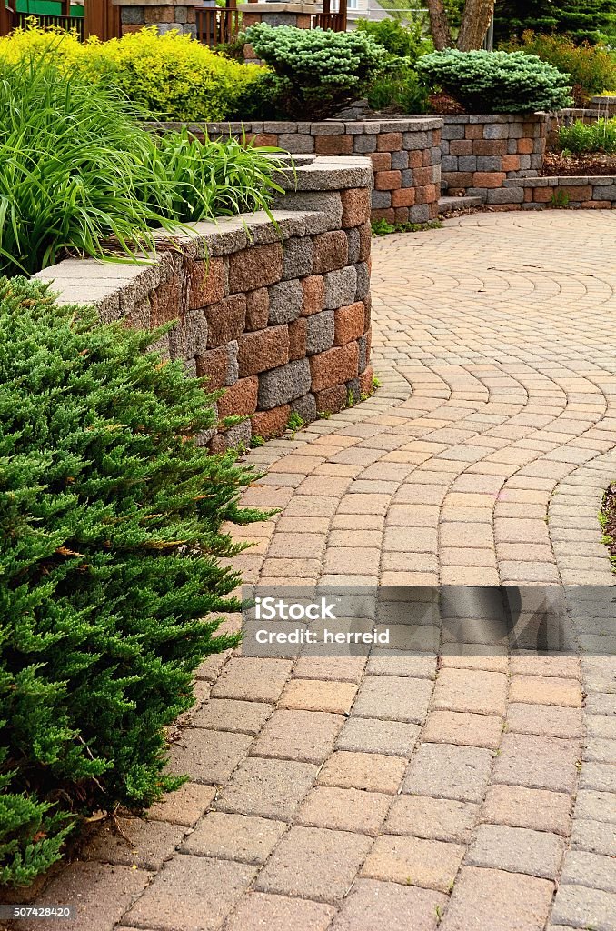 Retaining Wall and Patio Retaining Wall and Patio with Landscaping and Pavers Patio Stock Photo