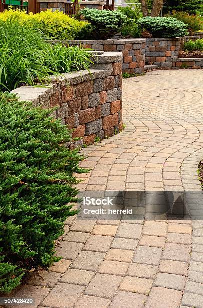 Retaining Wall And Patio Stock Photo - Download Image Now - Patio, Paving Stone, Retaining Wall