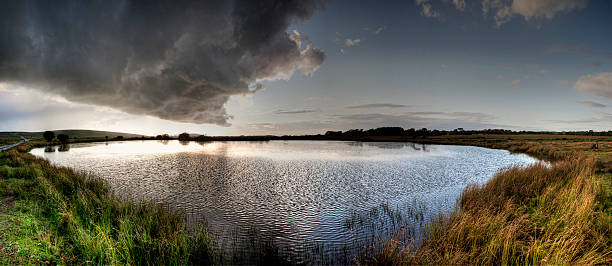 istock Pond on Gower moorland at sunset 507428593