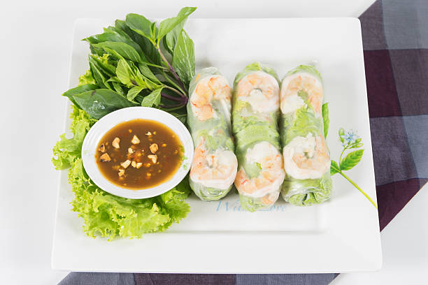 Fresh Roll with shrimp inside Fresh Roll with shrimp inside and chicken, tofu, bean sprouts, lettuces, mint leaf, cucumber, carrots wrap and tamarind hoisin sauce hoisin sauce stock pictures, royalty-free photos & images