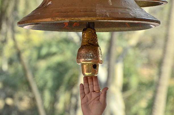 istock Believer in god ringing temple bell in India 507430255