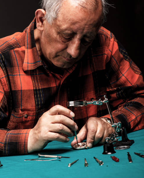 istock Repairing old pocket watch 507431995