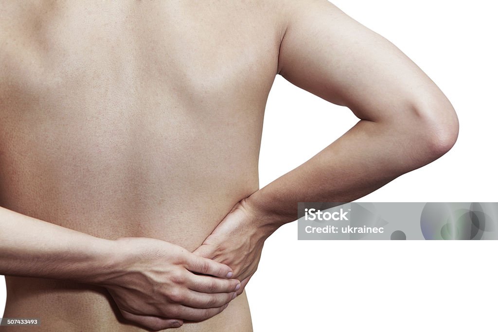 Umbosacral radiculitis Young male holding his back in pain. On a white background Adult Stock Photo