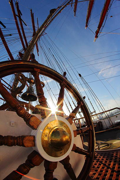 istock sun shining through the ship's helm 507434299
