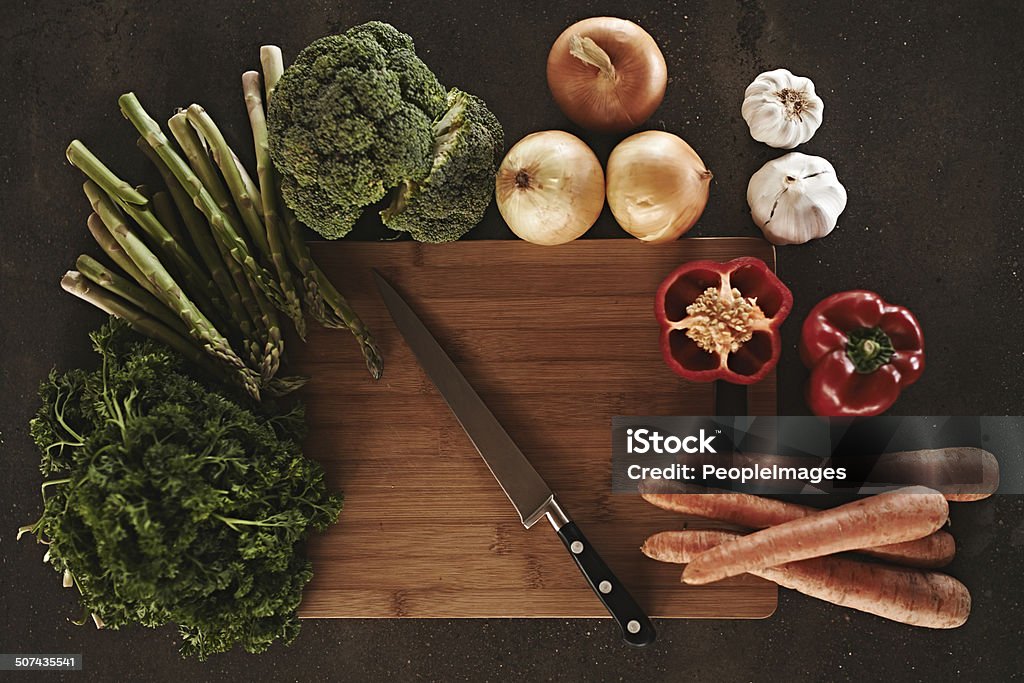 Ready, set, chop! Vegetables on a chopping board Asparagus Stock Photo