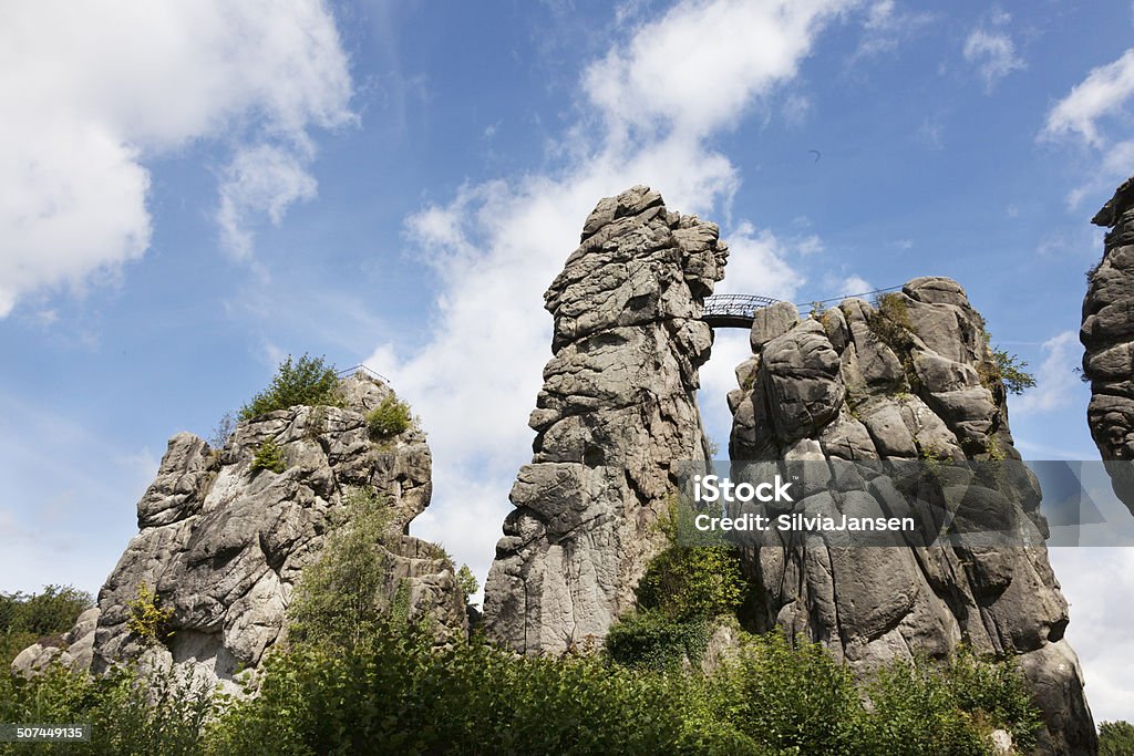 externsteine rock formation in North Rhine Westfalia  Germany The "Extersteine", a rock formation made of sandstone, in the Lippe district, near Detmold, Bielefeld and Paderborn, North Rhine Westfalia.  Externsteine Stock Photo