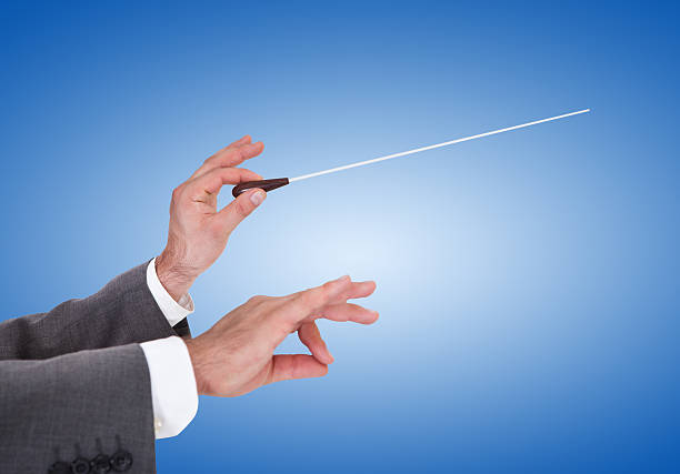 istock Person Directing With A Conductor's Baton 507450205