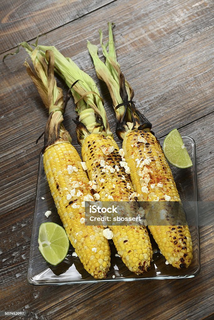 Elote Corn on the Cob Elote or Mexican grilled corn on the cob served with cotija cheese and chili powder. Corn Stock Photo