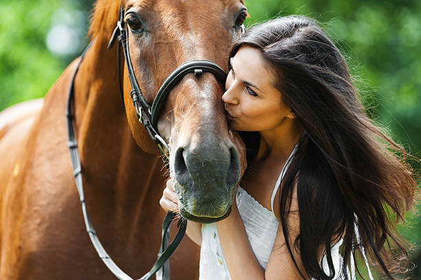 istock woman kissing horse 507452429