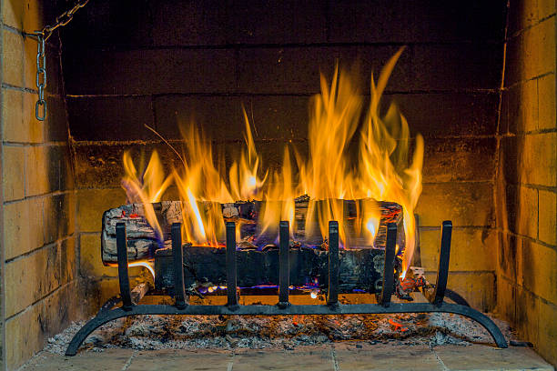 istock Fireplace in the house. Firewood burns in a fireplace. 507452694