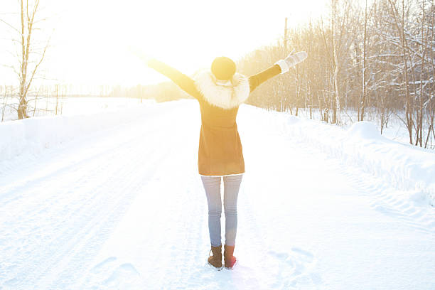 istock Joyful woman enjoying the winter snow . 507453578