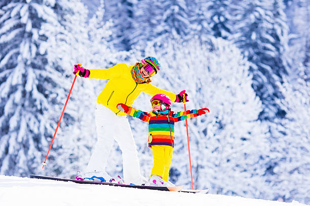 istock Mother and little girl learning to ski 507454096