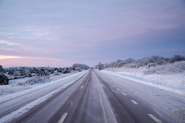istock Snowy asphalt country road 507454378