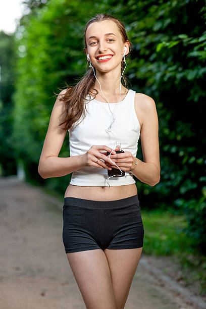 istock Running woman. Female runner relaxing after jogging outdoor work 507454583