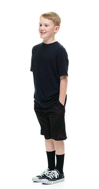 istock Smiling little boy standing and looking away 507454588