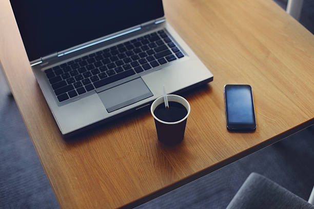 istock Workplace with laptop, smartphone and cup of coffee 507454974