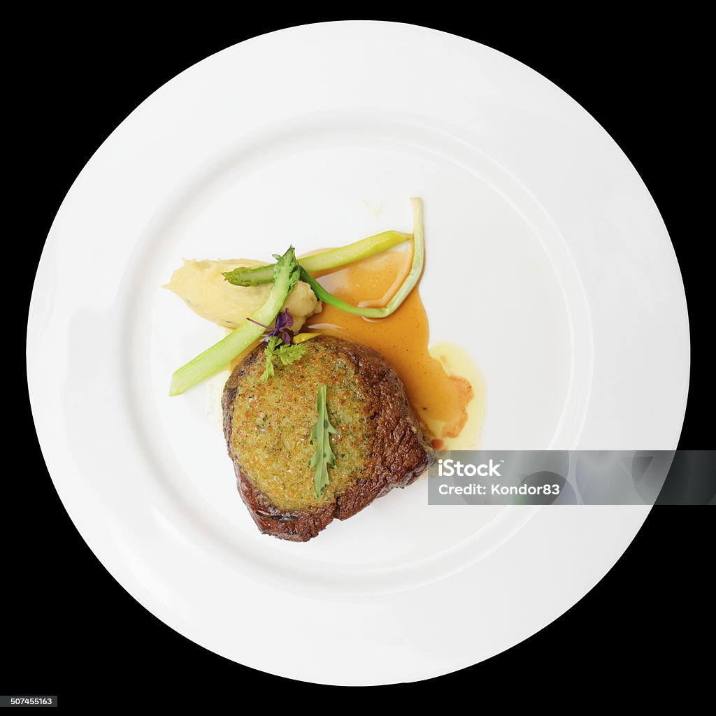 Rib eye steak with potato puree, isolated Rib eye steak with potato puree, isolated on black background Arrangement Stock Photo